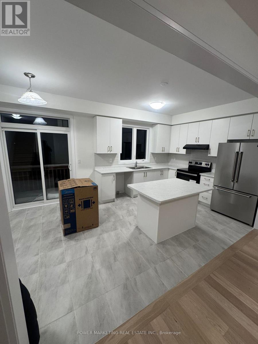 A kitchen with a white counter top and a refrigerator.