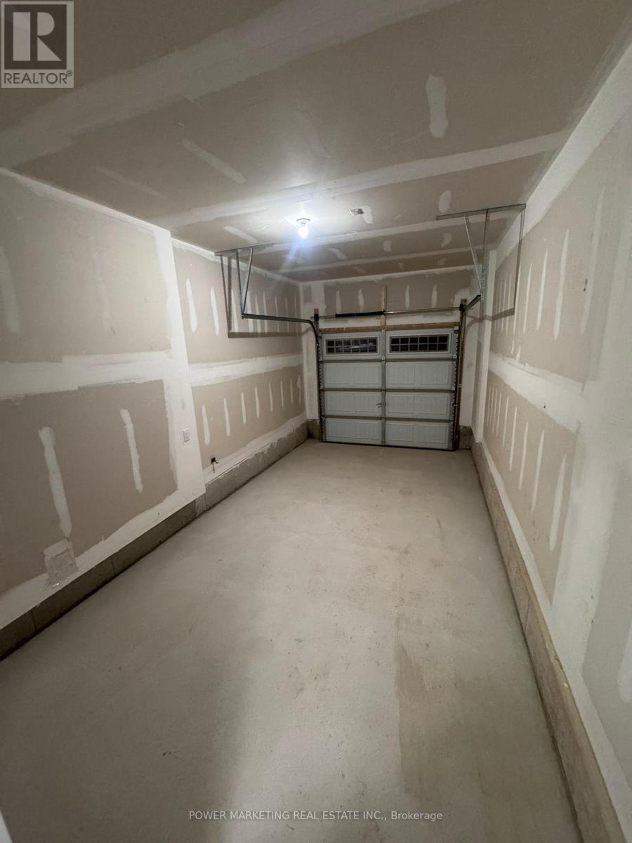 A long, narrow storage space with a metal shelving unit in the middle.