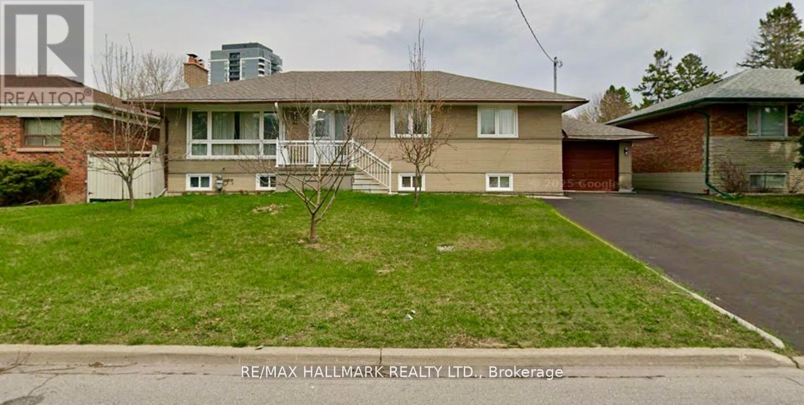 A house with a lawn in front of it is for sale.