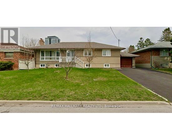 A house with a lawn in front of it is for sale.