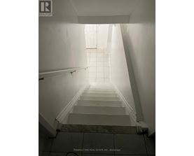 A staircase leading to a bright light at the top.