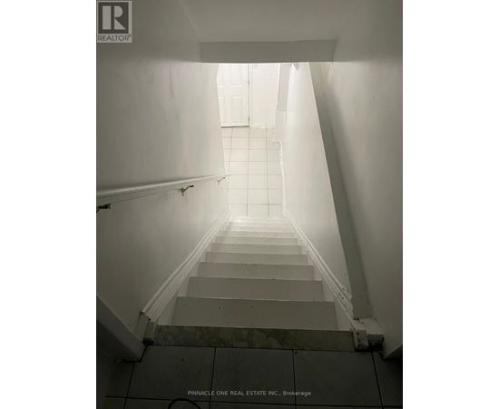 A staircase leading to a bright light at the top.