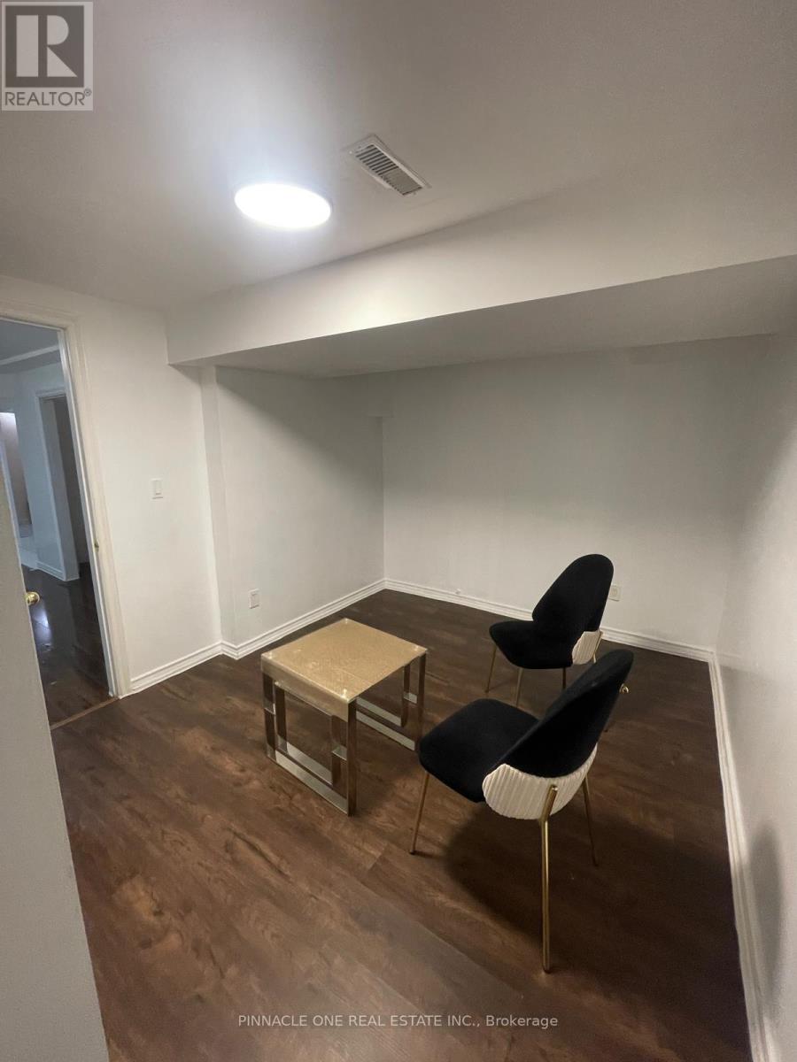 A room with a table and two chairs.