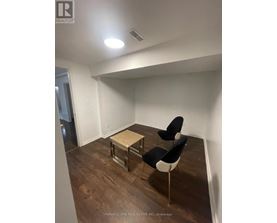 A room with a table and two chairs.