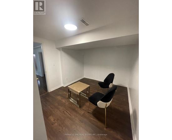 A room with a table and two chairs.