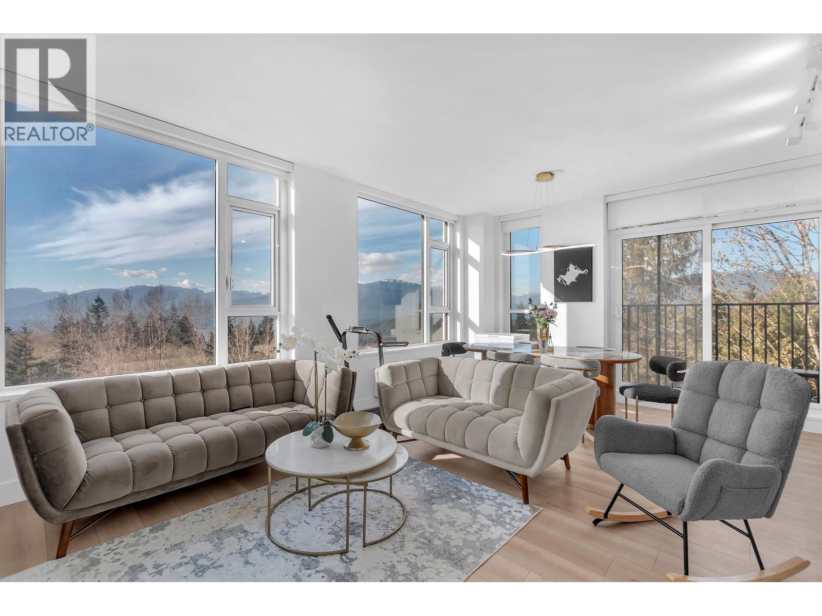 A living room with a grey sofa and a coffee table.