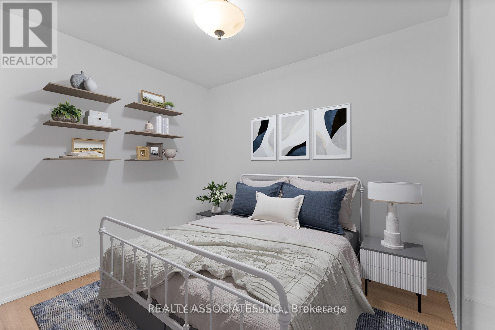 A bedroom with a bed, nightstand, and shelves with decorative items.