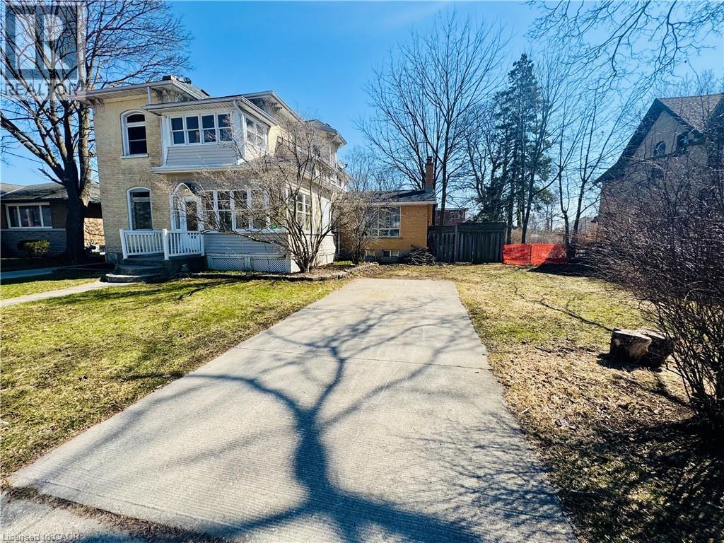 A house with a driveway in front of it.