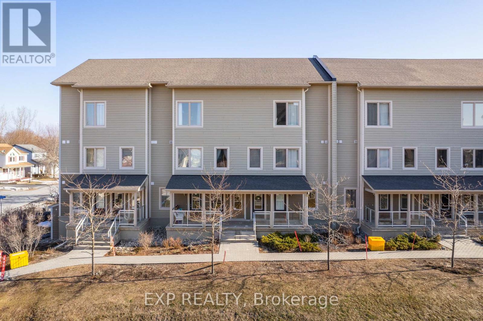 A building with the text EXP REALTY, Brokerage in front of it.