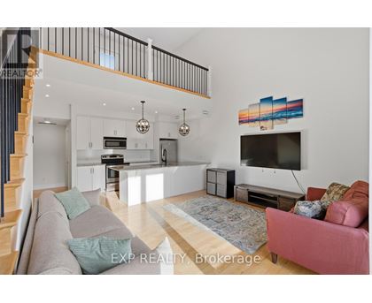 A living room with a grey couch and a pink couch.