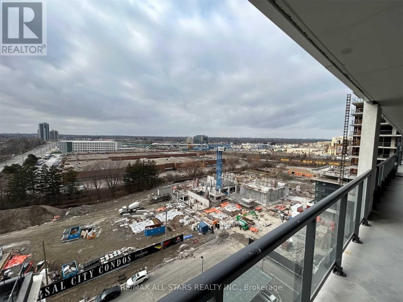 A construction site for Sal City Condos is seen from a balcony.
