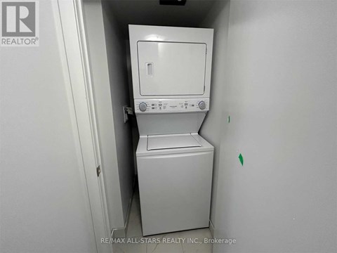 A white dishwasher is installed in a small kitchen.