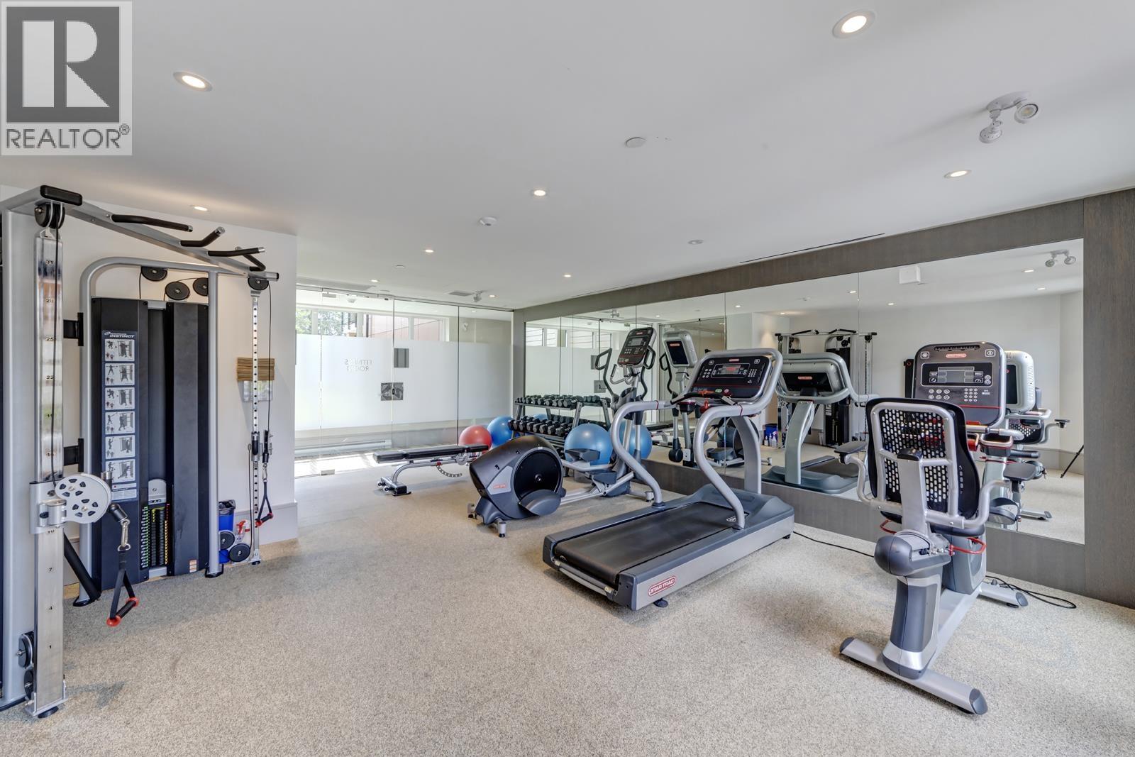 A well-equipped gym with a variety of exercise machines.