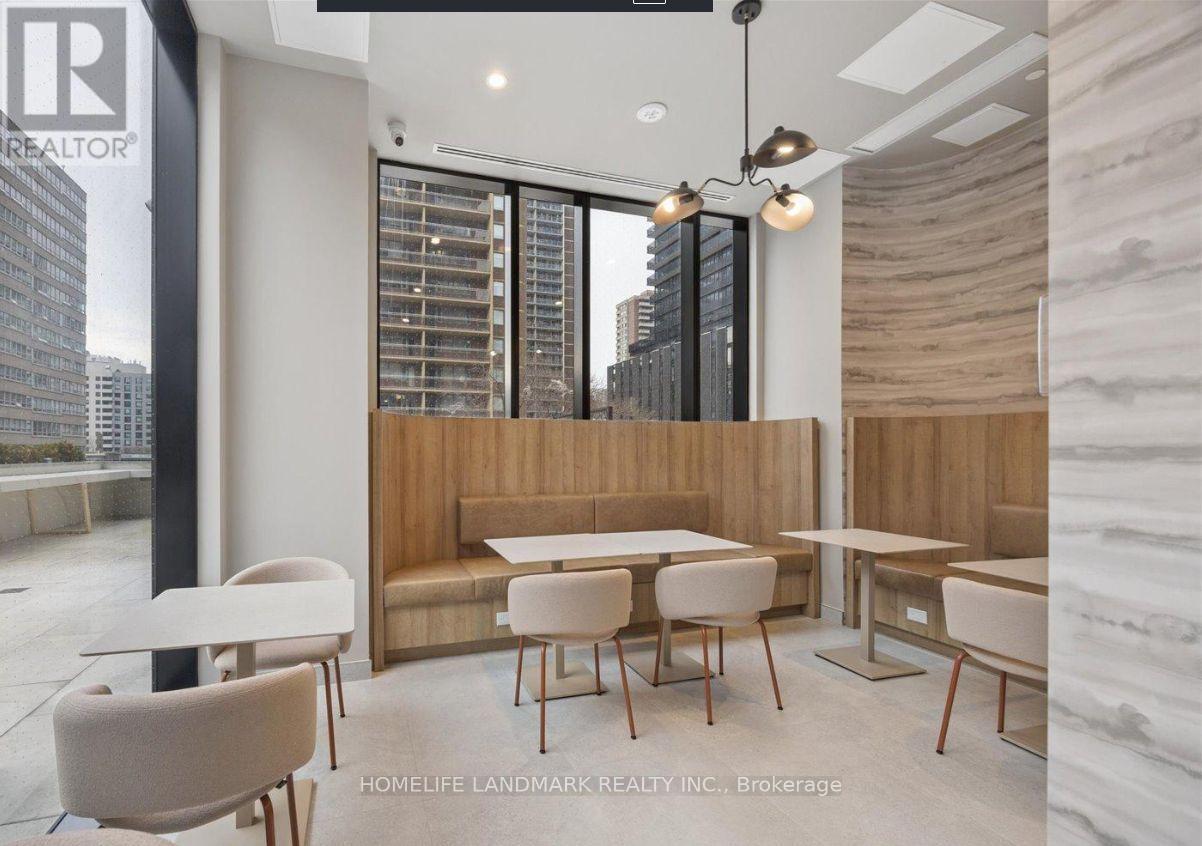 A modern dining area with a view of the city.