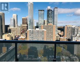 A cityscape with skyscrapers and a sign for HomeLife Landmark Realty Inc. Brokerage.