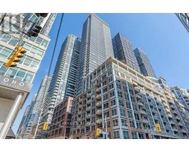 A tall building with many windows is in the foreground of the image.
