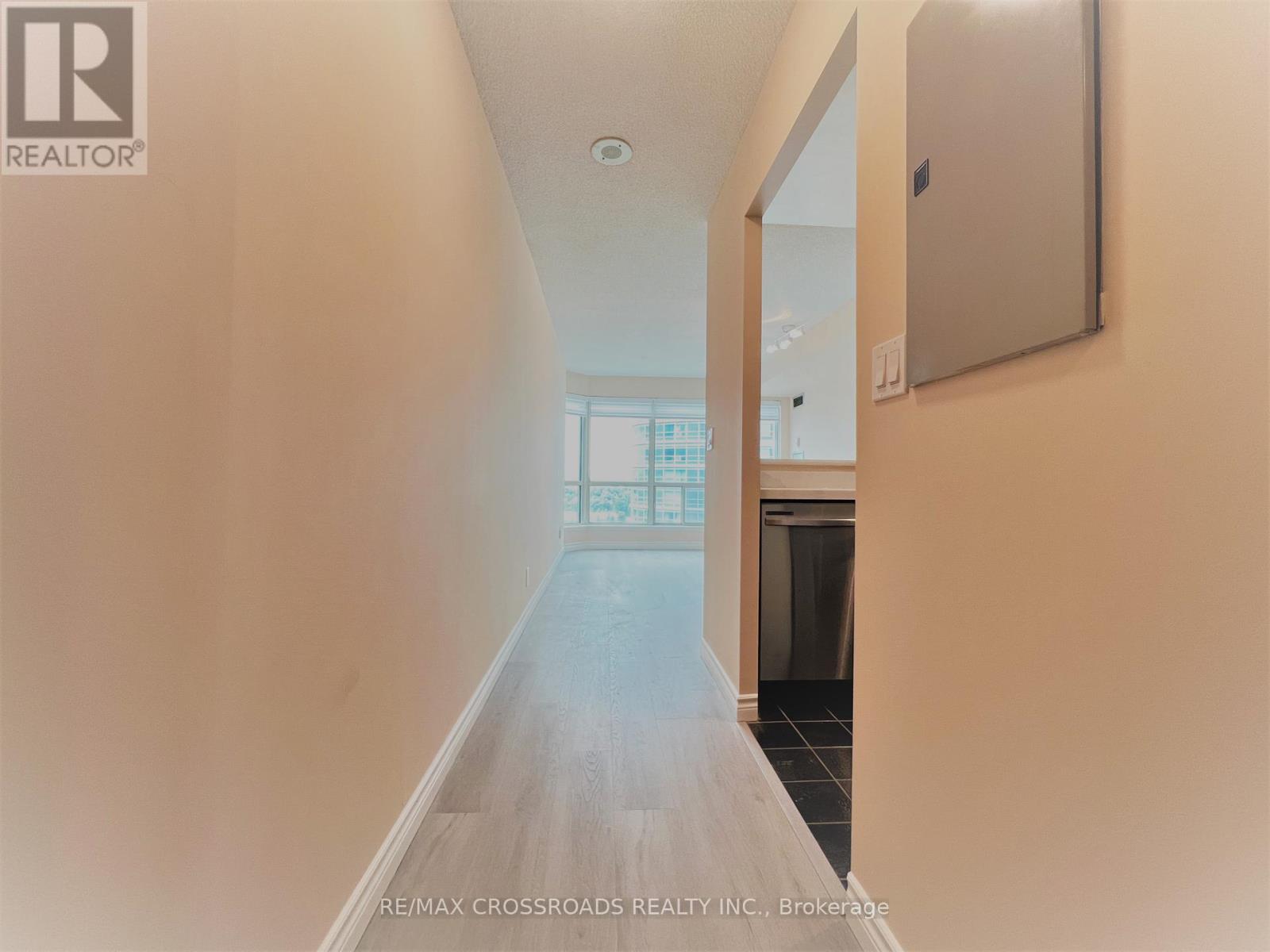 A long hallway with a door at the end.