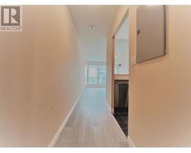 A long hallway with a door at the end.