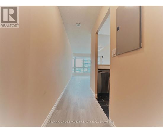 A long hallway with a door at the end.