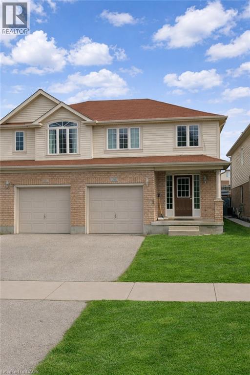 A house with a brown roof and a garage door.