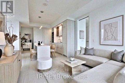 A modern living room with a white sofa and a wooden coffee table.