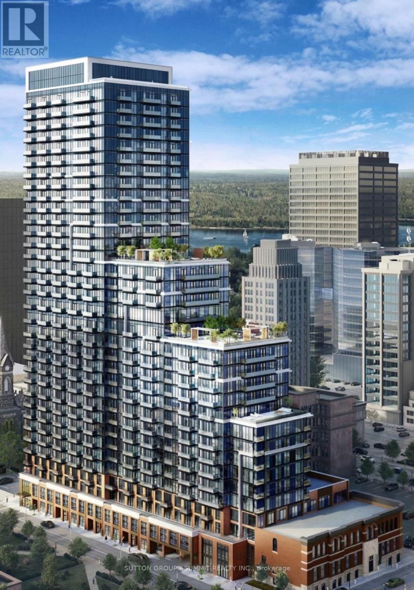 A tall building with a lot of windows is the main focus of the image.