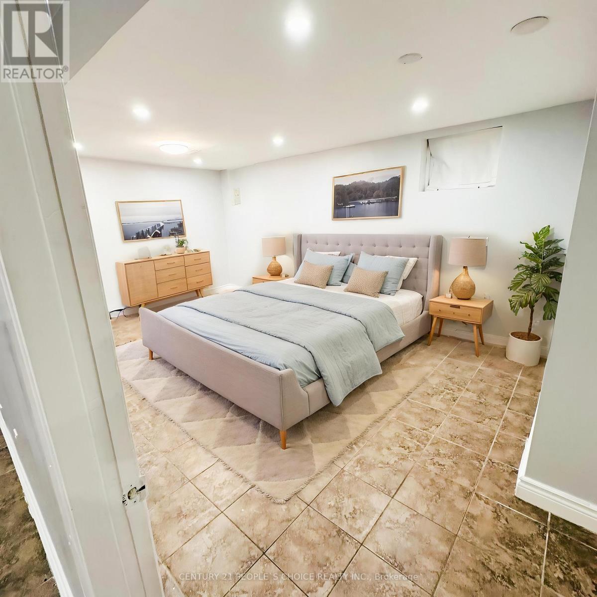 A room with a tiled floor and a window covered with blinds.