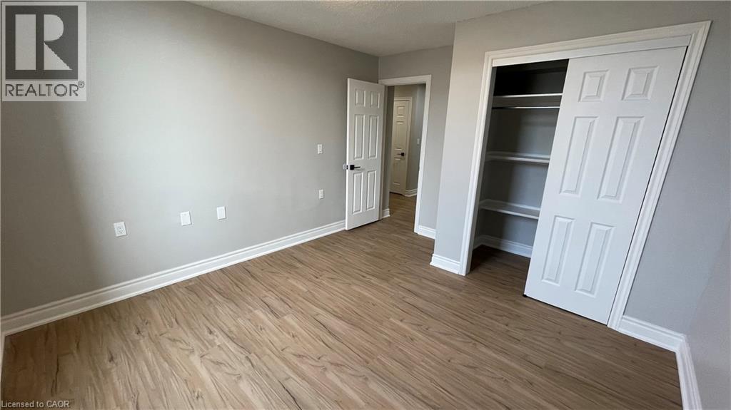 A room with a white door and a white cabinet.