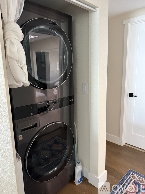 A washer and dryer are in a small space.