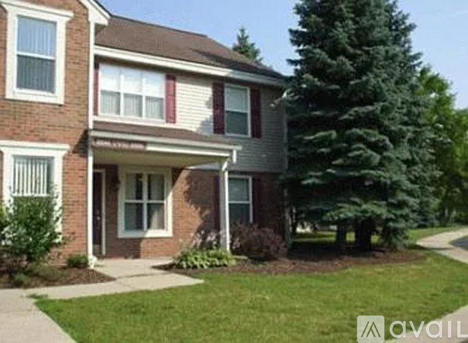 A house with a red and white striped awning.