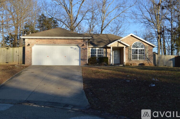 A house with a garage is available for sale.
