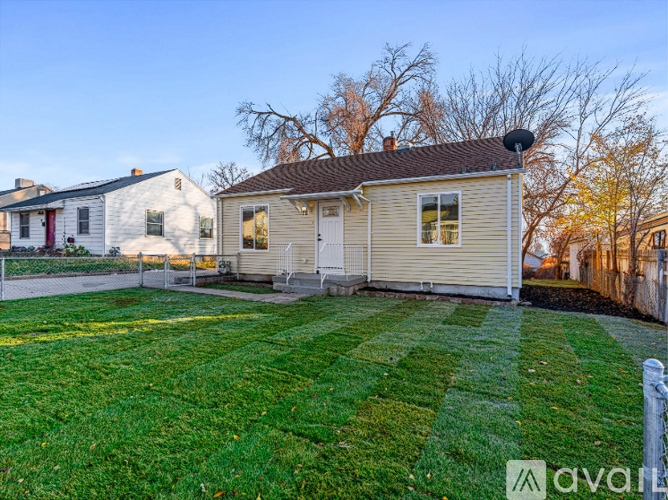 A house with a fenced yard is for sale.
