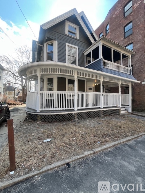 A two-story house with a white porch.