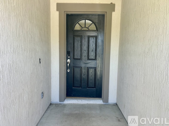 A black door with a glass window above it.