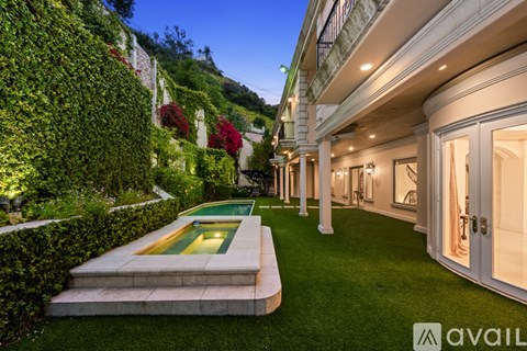 A house with a pool in the backyard.