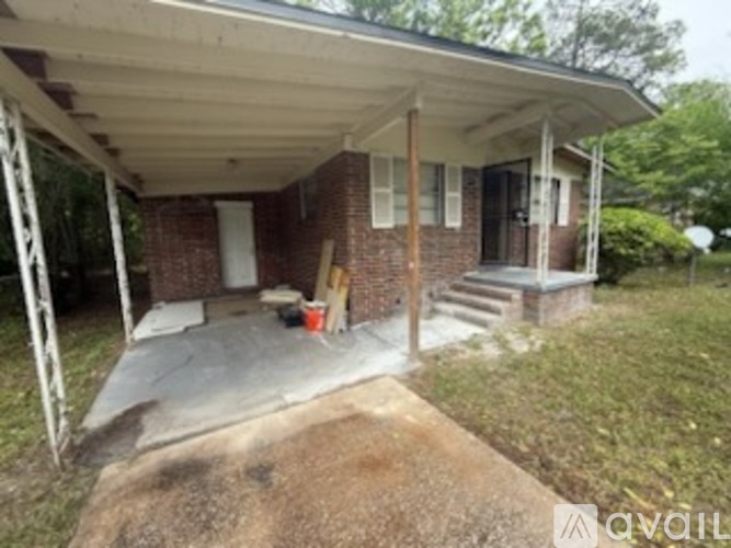 A house with a porch and a covered patio.