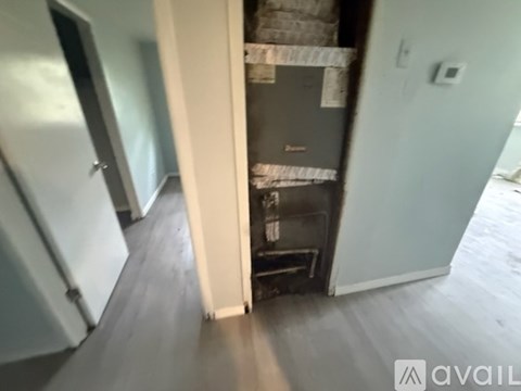 A kitchen with a fridge and a stove top oven.