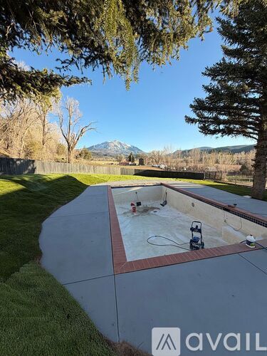 A pool with a hose attached to it.