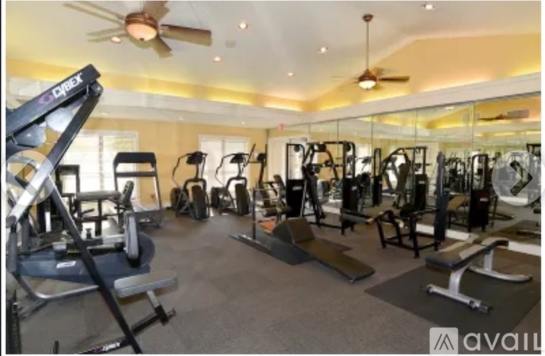 A well-equipped gym with a variety of machines and weightlifting equipment.