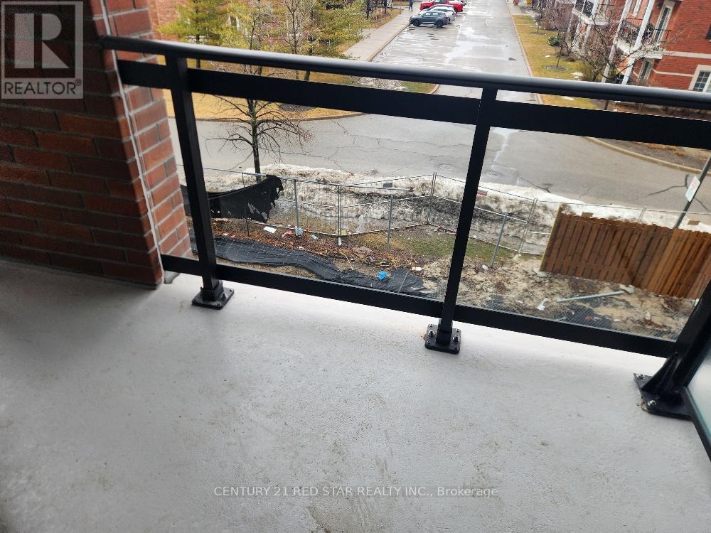 A balcony with a view of a street and buildings.