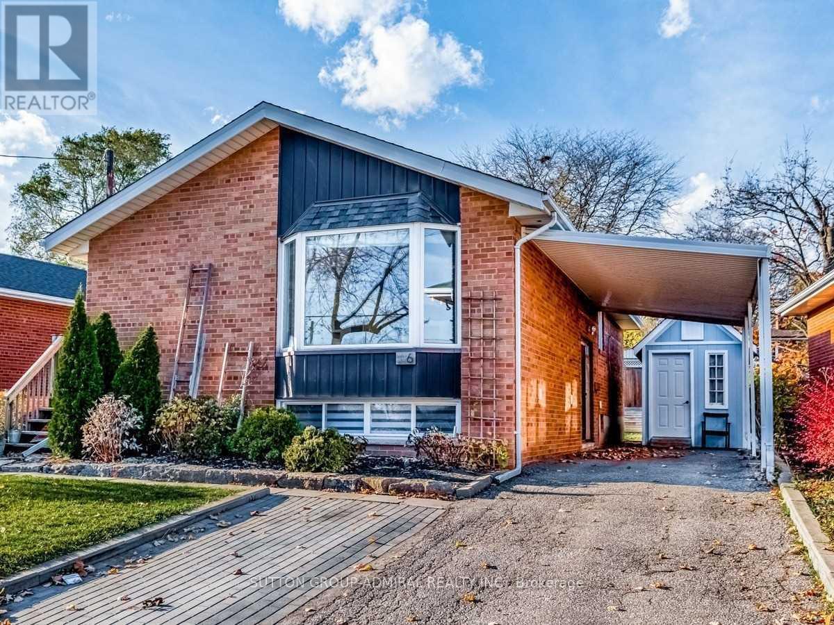 A house with a brick exterior and a covered porch.