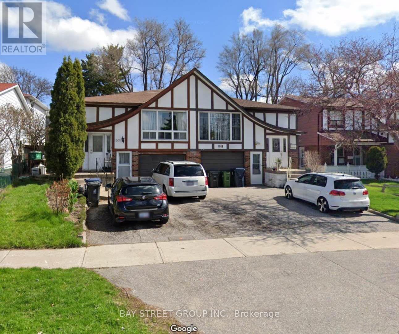 A bay street group inc brokerage sign is on a house.
