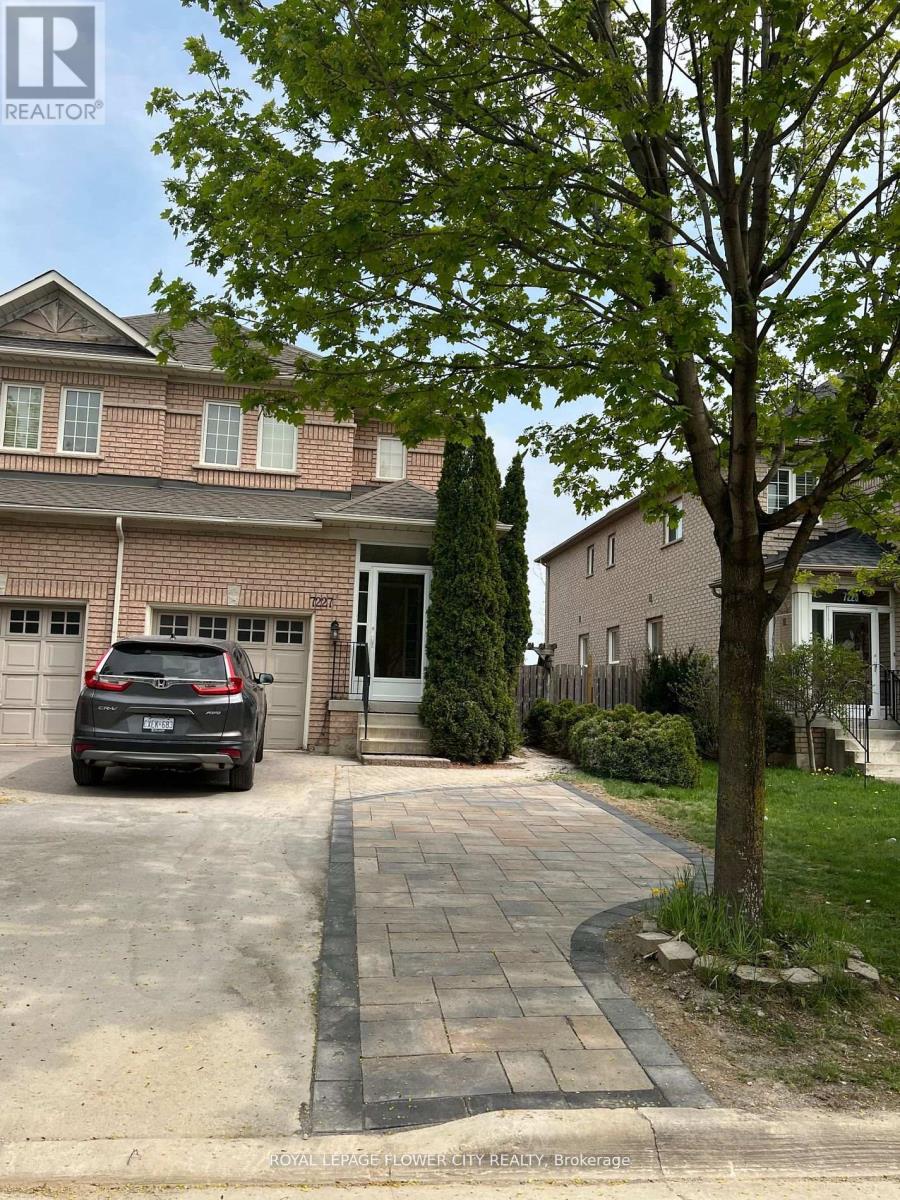 A house with a tree in front of it.