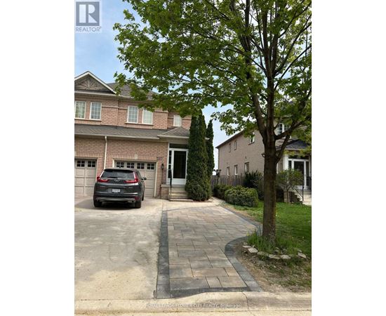 A house with a tree in front of it.