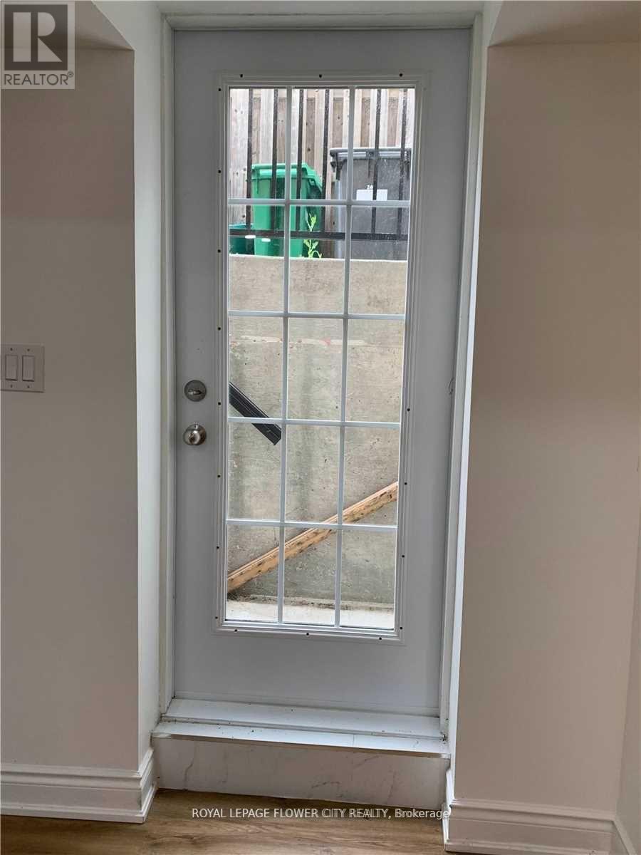 A white door with a glass window and a handle.