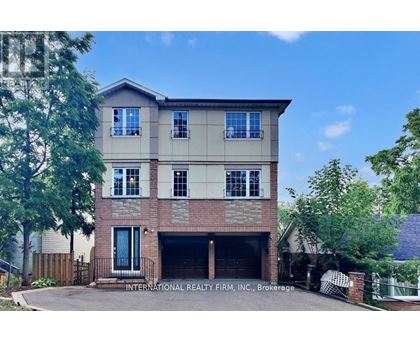 A two-story house with a garage is for sale.
