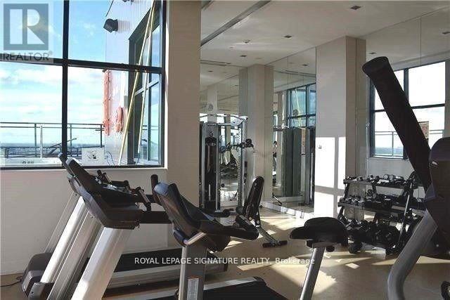 A gym with treadmills and exercise bikes is labeled "Royal LePage Signature Realty.".