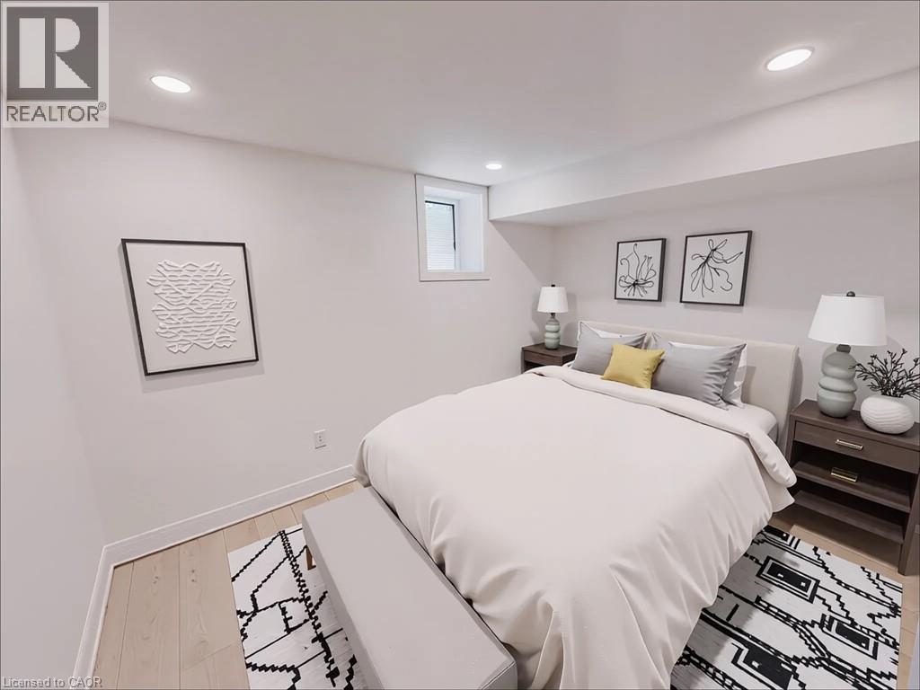A bedroom with a large bed and two lamps on the nightstand.