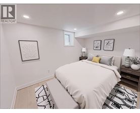 A bedroom with a large bed and two lamps on the nightstand.