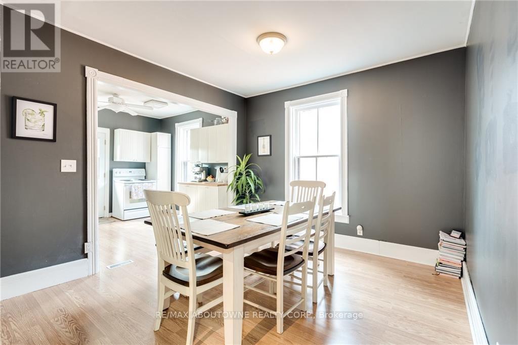 A dining room with a table and chairs.